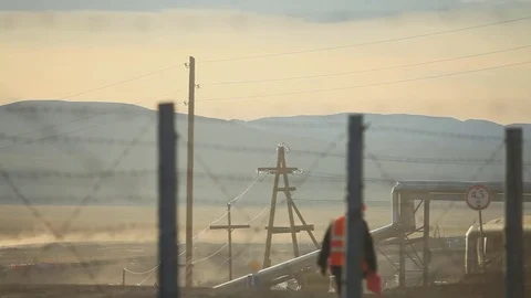 Worker goes through the territory of the enterprise Stock Footage 75892486