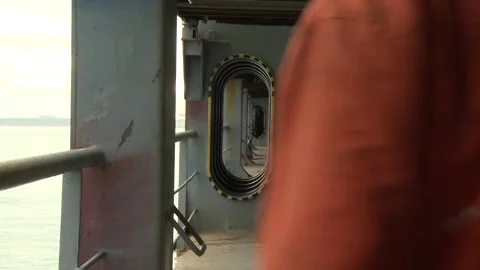 Worker going through ship corridor slow motion Stock Footage 102629296