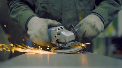 Worker with a grinder grinds metal 스톡 동영상 98606641