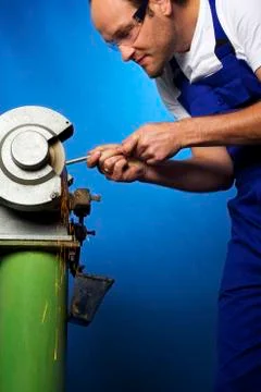 Worker on grinding bench Stock Photos