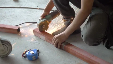 Worker grinding a cable trunking 스톡 동영상 296173309