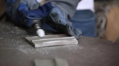 Worker grinding a casting part in factory. Industrial safety first concept. Stock Footage 297193924