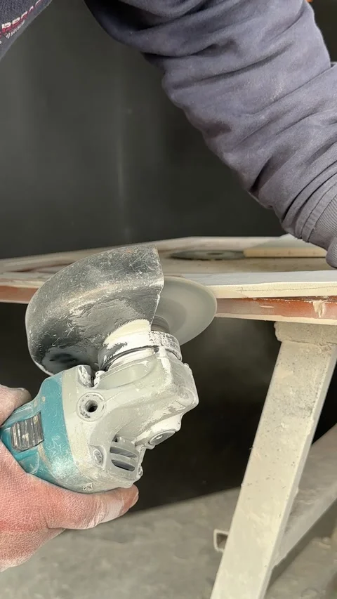 Worker Grinding Ceramic Tile Edge with Electric Angle Grinder Close Up Stock Footage 315090325