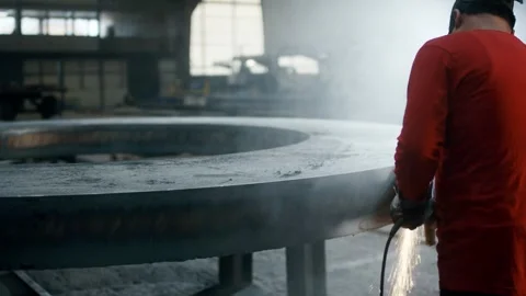 Worker Grinding Large Steel Ring, Heavy Industry Hall, Wide Shot Stock Footage 341530230