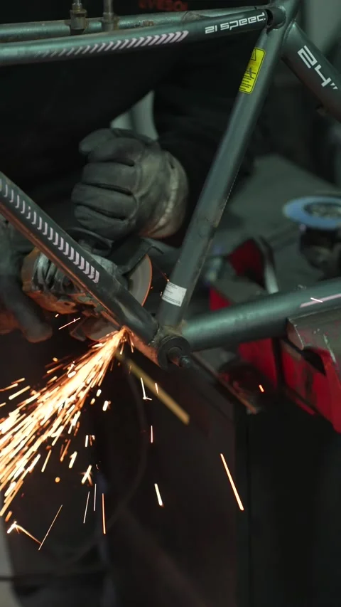 Worker Grinding Metal with Angle Grinder Stock Footage 308827853