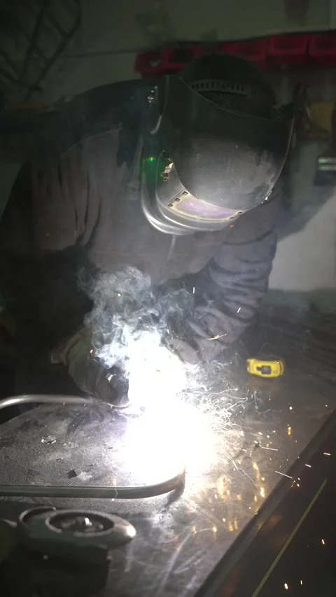 Worker Grinding Metal with Angle Grinder Stock Footage 308829005