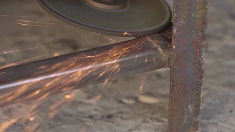 Worker grinding metal construction after welding Stock-Footage 105745475