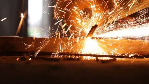 Worker grinding metal construction with a circular saw Stock Footage 70845607