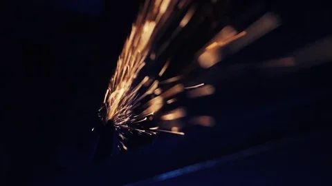 Worker grinding metal construction with a circular saw Stock Footage 80857932