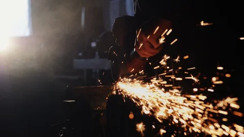 Worker grinding metal construction with a circular saw Video stock 87344855