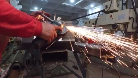 Worker grinding steel Stock Footage 81663877