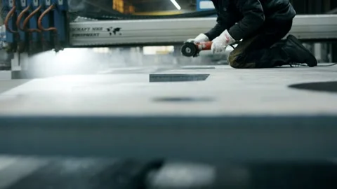 Worker Grinding Steel Plate with Angle Grinder, Metal Workshop, Sparks Flying Video stock 341531035