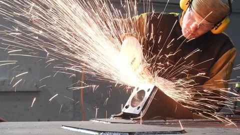 Worker grinding weld seam with grinder machine and sparks Stock Footage 84118248