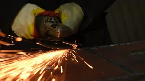 Worker grinding weld seam with grinder machine and sparks. Slow motion 動画素材 87540876