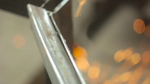 Worker grinds metal Stock Footage 75309472