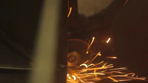 Worker grinds metal Stock Footage 75309694