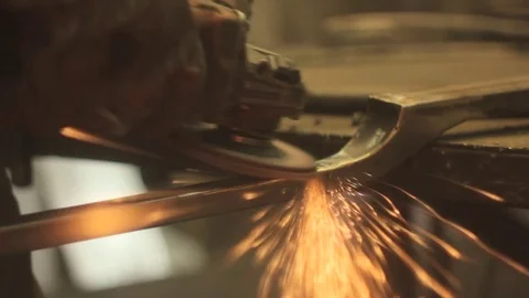 Worker grinds metal Stock Footage 75516929