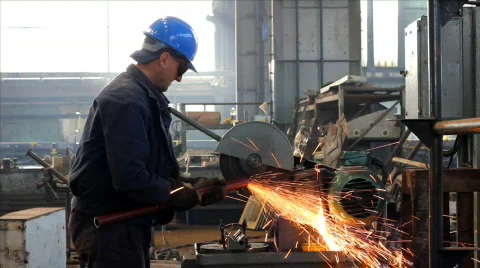 Worker grinds a metal pipe Stock Footage 874262