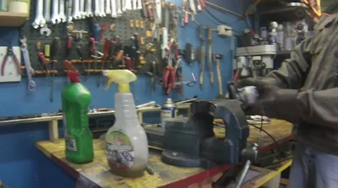 Worker grinds a metal pipe Stock Footage 32179883