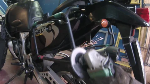 Worker grinds a metal pipe Stock Footage 32179894