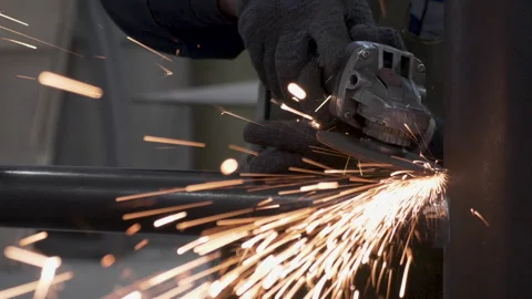 A worker grinds a metal structure 스톡 동영상 244226074