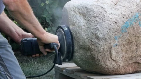 Worker grinds raw stone,  grinding machine, sound Stock Footage 215698256