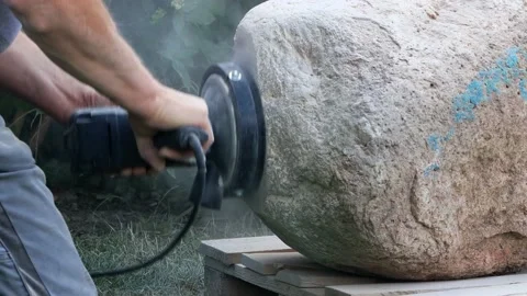 Worker grinds raw stone,  grinding machine, sound Stock Footage 215698414