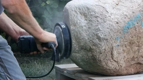 Worker grinds raw stone,  grinding machine, sound Stock Footage 221507901