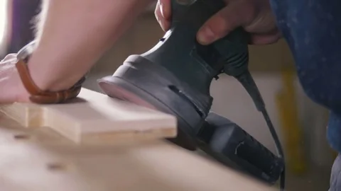 Worker grinds the wood of angular grinding machine Video stock 72596107