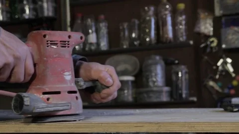 Worker grinds the wood of angular grinding machine Stock Footage 73162357