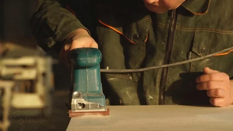 Worker grinds the wood of angular grinding machine Stock Footage 76276657