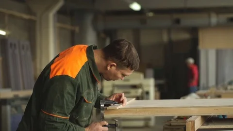 Worker grinds the wood of angular grinding machine Stock Footage 76277469