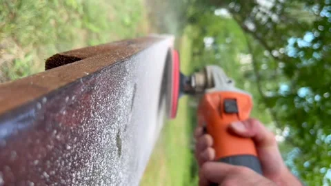 Worker grinds the wood of angular grinding machine. Vertical video for the Vídeos de archivo 222772503