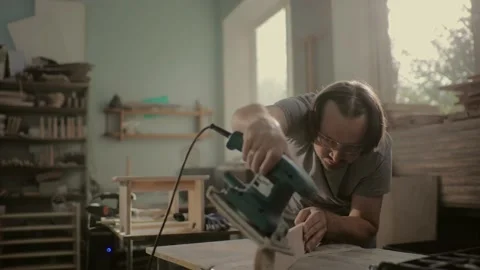 Worker grinds the wood of grinding machine. Stock Footage 219347087