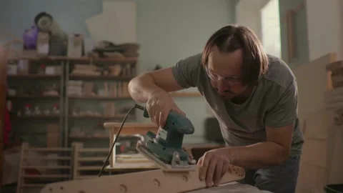 Worker grinds the wood of grinding machine. Stock Footage 219347104