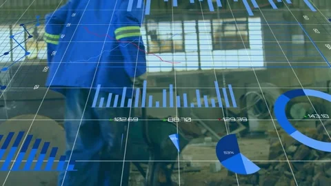Worker gripping barrow handles moving load in factory, data overlay following Stock Footage 335316921