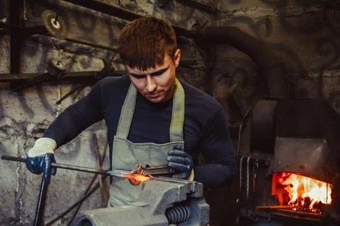 The worker grips the vice Stock Photos