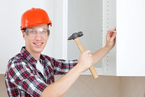 Worker with a hammer Stock Photos