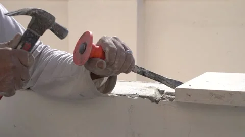 Worker Hammering a Brick, Close Up, Slow Motion Stock Footage 167266449