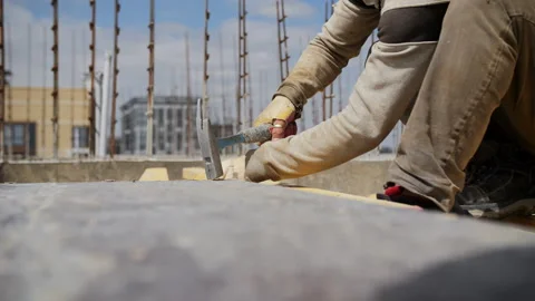 Worker Hammering on Construction Site Stock Footage 314058721