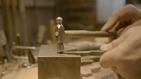 Worker hammering a metal piece Stock Footage 87612441