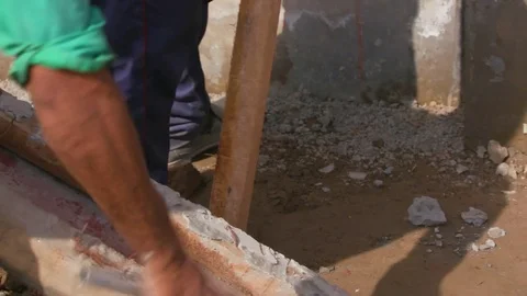 Worker hammering a wooden plank Stock Footage 77447532