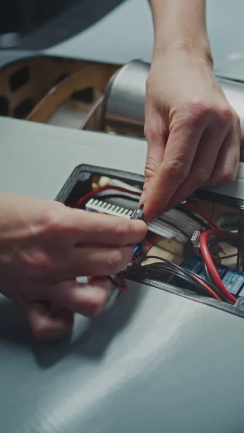 Worker Hand Assembling Critical Electronic Modules Into Next Generation Drone Stock Footage 322095290