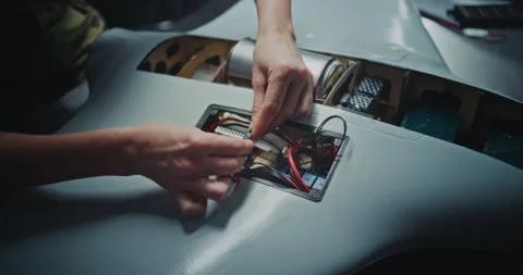 Worker Hand Assembling Critical Electronic Modules Into Next Generation Drone 動画素材 322108622