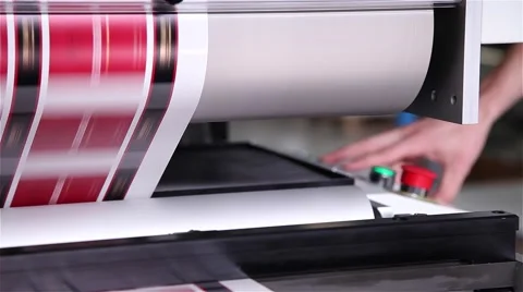 Worker hand controlling printing press labels being printed Stock-Footage 57284830