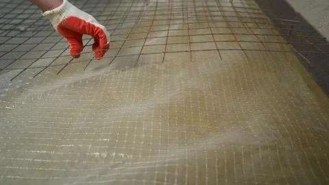 Worker Hand Installing Reinforcement Mesh for Plastering Stock Photos