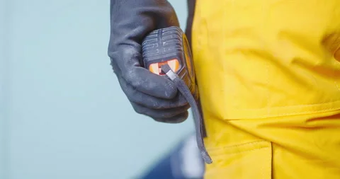 Worker hand in safety Protective glove holding measuring tape close up Stock Footage 150723607