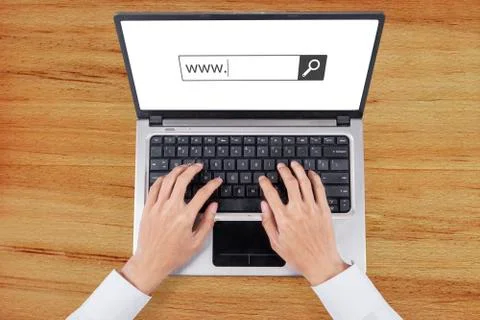 Worker hand types www text on laptop Foto stock