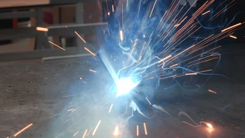 Worker hand welding small metallic parts - close up Видео 159773030