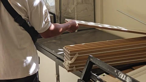Worker Handling And Inspecting Stack Of Decorative Wooden Wall Panels In Worksho Stock Footage 340001987